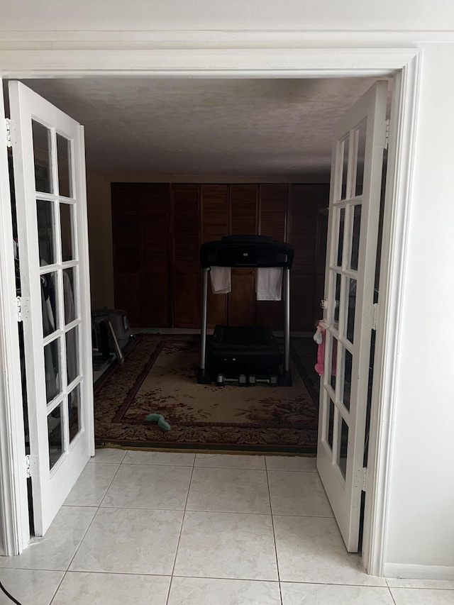 living room featuring french doors and light tile flooring