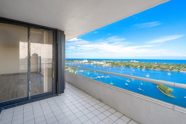 balcony featuring a water view