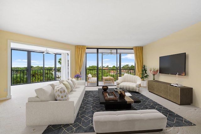 carpeted living room featuring ceiling fan