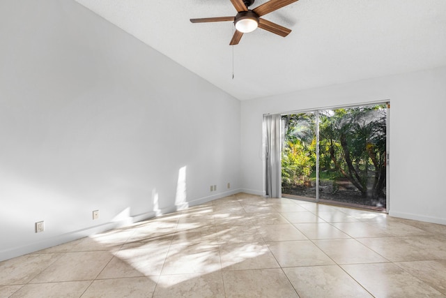 22230 Cameo Dr E, Boca Raton, FL 33433 - unfurnished room featuring baseboards, ceiling fan, vaulted ceiling, and tile patterned flooring