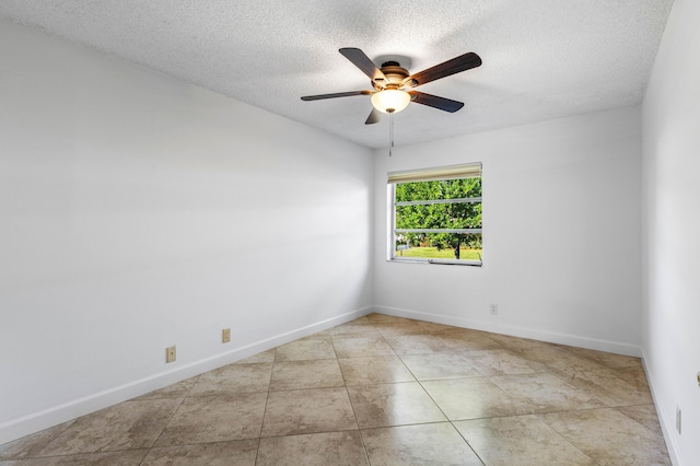 22230 Cameo Dr E, Boca Raton, FL 33433 - tiled empty room with a ceiling fan, baseboards, and a textured ceiling