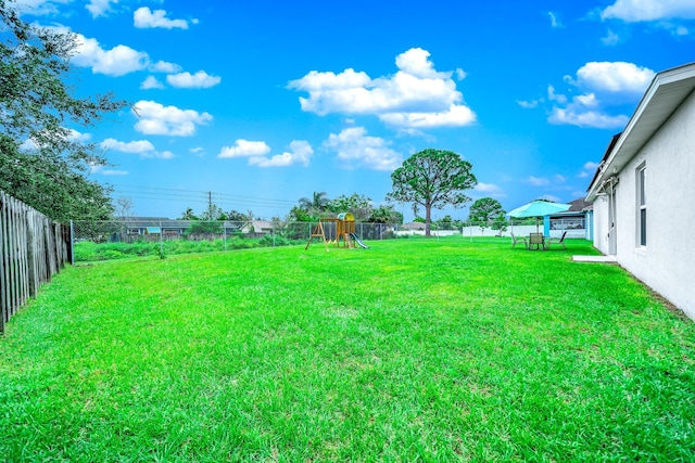 view of yard with a playground