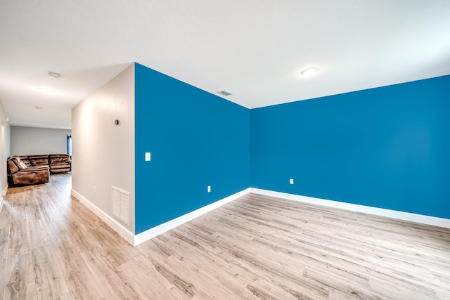 unfurnished room featuring light hardwood / wood-style flooring