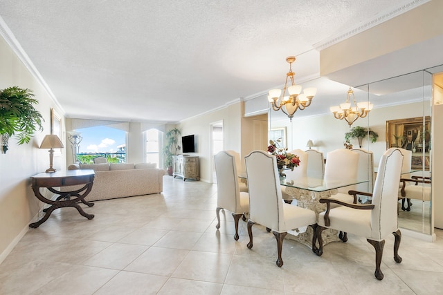 tiled dining room with ornamental molding, a notable chandelier, and a textured ceiling