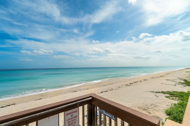 property view of water featuring a beach view