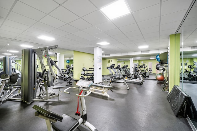 workout area featuring a drop ceiling