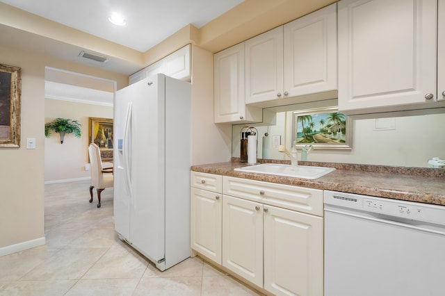 kitchen with white appliances, sink, light tile floors, crown molding, and white cabinets