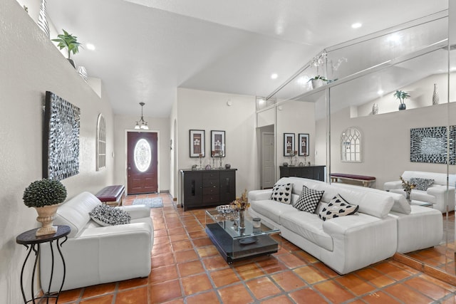 living room featuring tile patterned floors and high vaulted ceiling