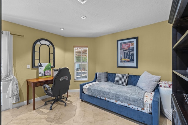 bedroom featuring a textured ceiling