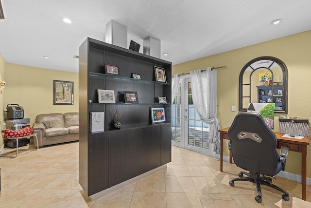 tiled home office with french doors and a textured ceiling