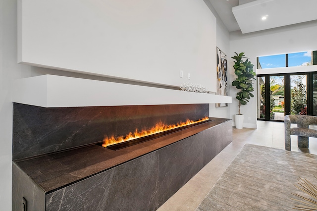 interior space with light tile floors and french doors