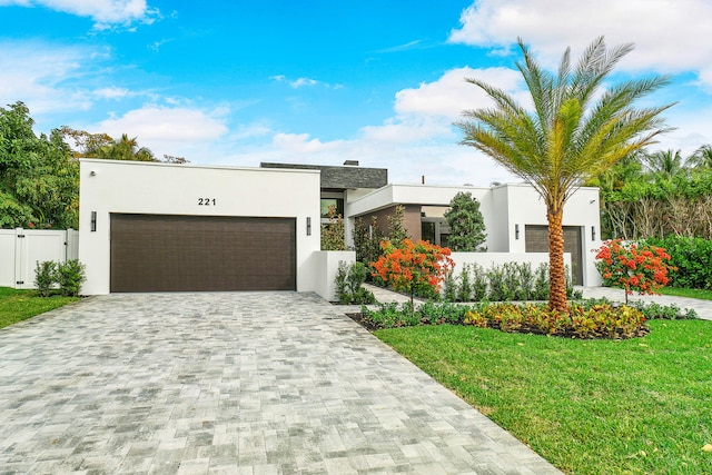 modern home featuring a front yard