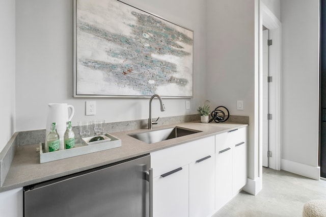 bar with light tile floors, white cabinetry, dishwasher, and sink