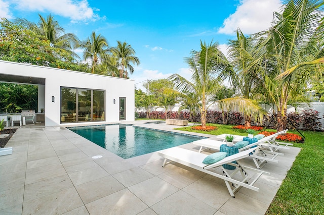 view of swimming pool featuring a patio and area for grilling