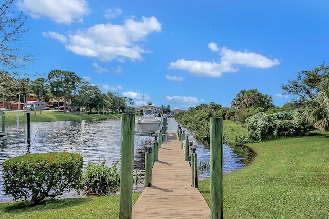 7186 SW Quiet River Ct, Stuart, FL 34997 - dock with a water view and a yard