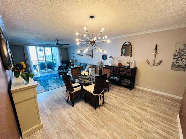 dining space with a textured ceiling, ceiling fan with notable chandelier, light wood-type flooring, and crown molding