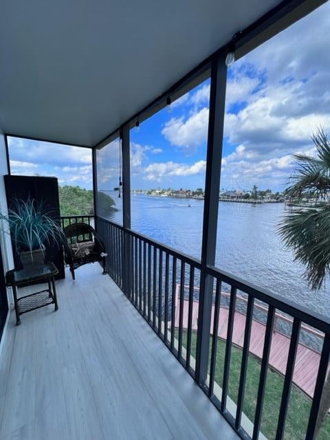 balcony featuring a water view