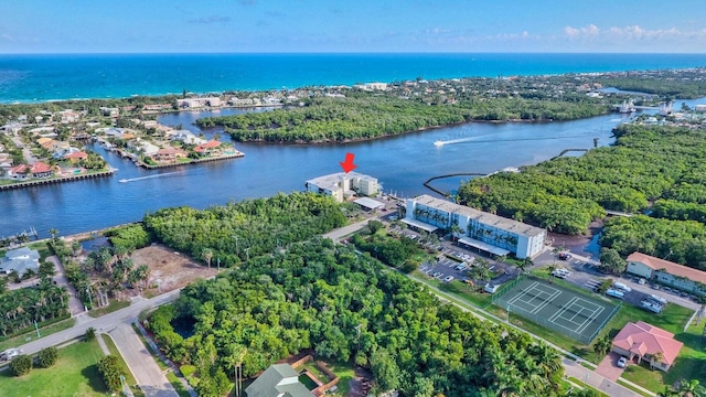 birds eye view of property with a water view