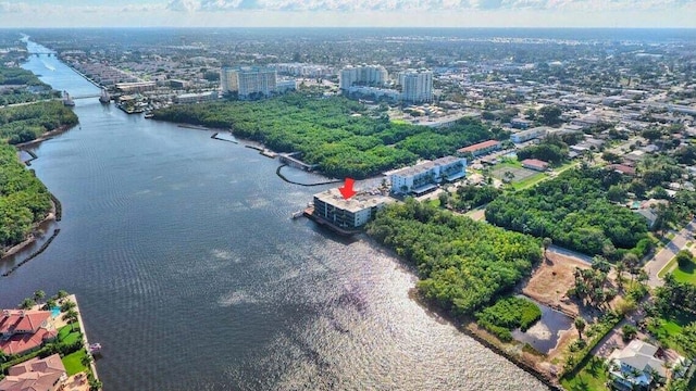 birds eye view of property with a water view