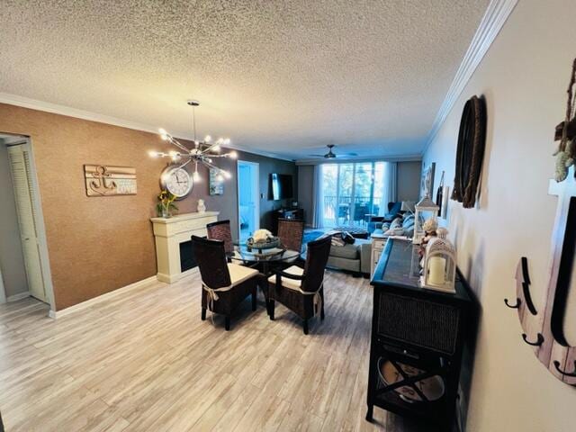 dining area with ceiling fan with notable chandelier, crown molding, hardwood / wood-style floors, and a textured ceiling