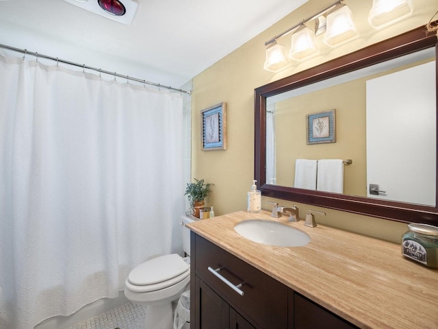 bathroom with curtained shower, tile patterned floors, vanity, and toilet