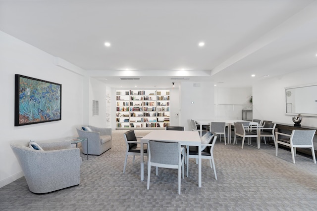 dining room featuring light colored carpet