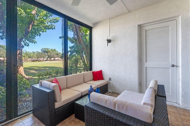 sunroom featuring ceiling fan