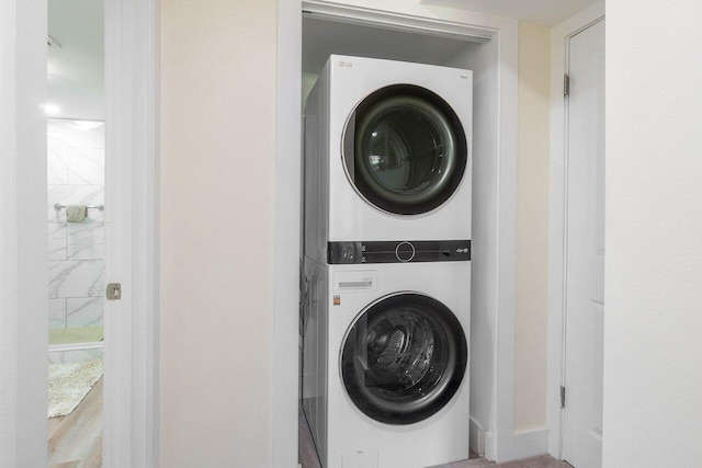 laundry room with stacked washer and clothes dryer