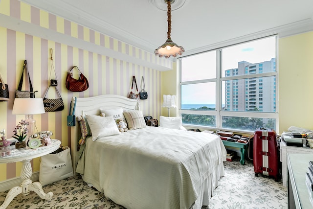 carpeted bedroom with ornamental molding