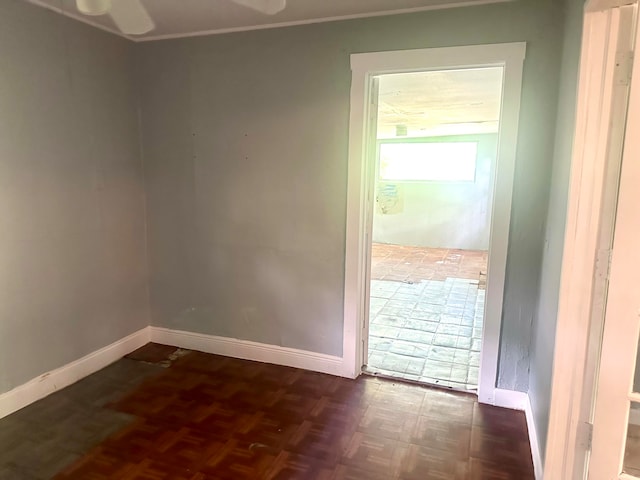 interior space featuring parquet flooring and ceiling fan