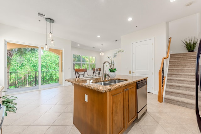 kitchen with sink, dishwasher, a center island with sink, light stone countertops, and decorative light fixtures