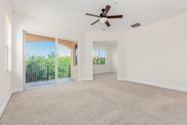 unfurnished room with ceiling fan and light colored carpet