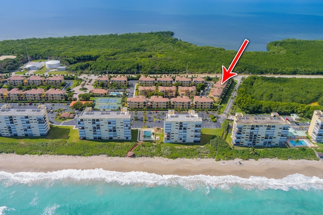 bird's eye view featuring a water view and a view of the beach