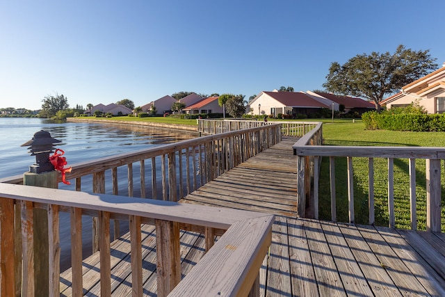 exterior space featuring a water view and a yard