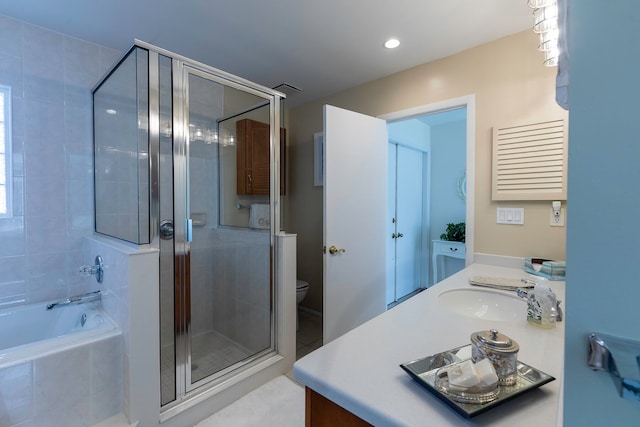 full bathroom with vanity, shower with separate bathtub, tile flooring, and toilet