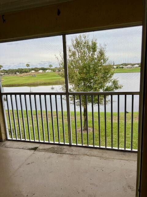 balcony featuring a water view