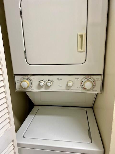 laundry area featuring stacked washing maching and dryer