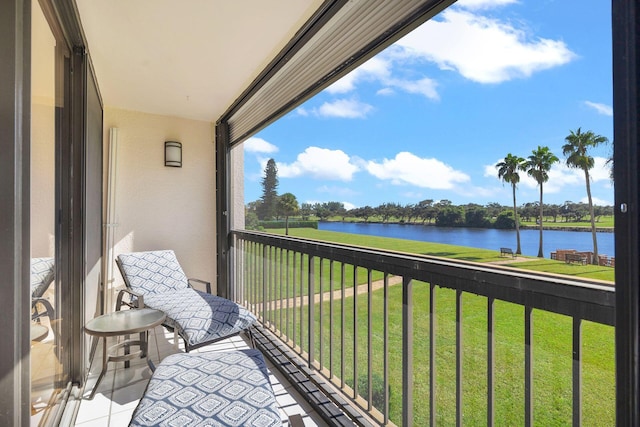 balcony featuring a water view