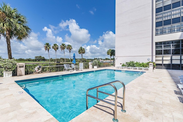 view of swimming pool featuring a patio