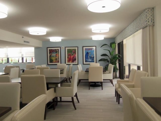 dining room with light hardwood / wood-style flooring