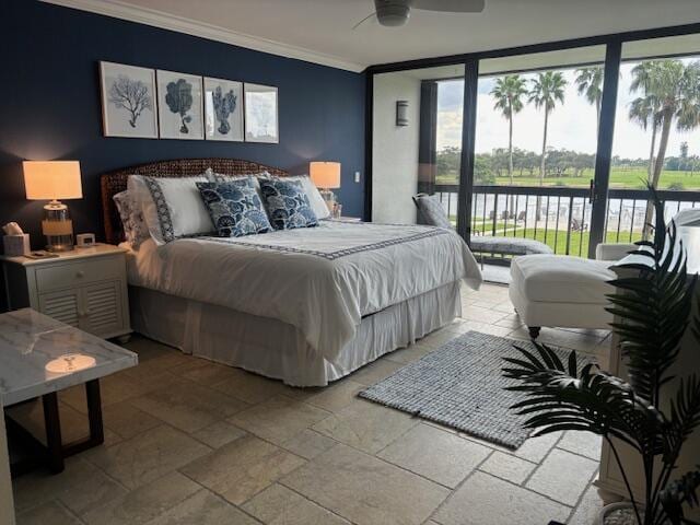 bedroom featuring access to exterior, ceiling fan, a wall of windows, a water view, and ornamental molding