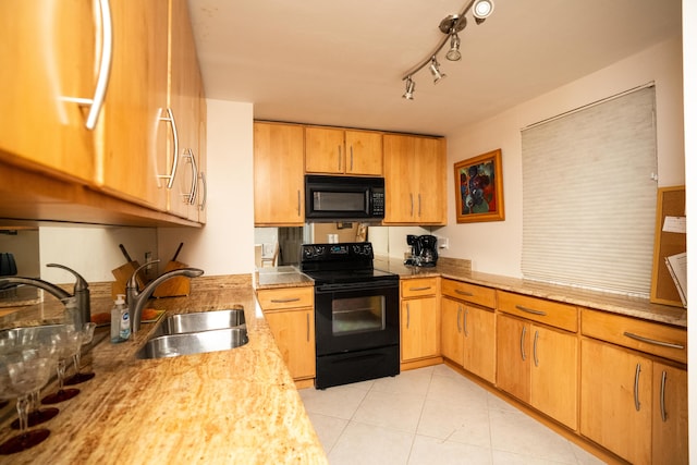 5200 N Flagler Dr Unit 803, West Palm Beach, FL 33407 - kitchen with black appliances, a sink, light tile patterned flooring, light stone counters, and track lighting