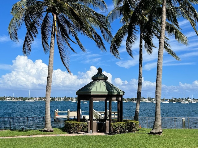 dock area with a gazebo and a water view