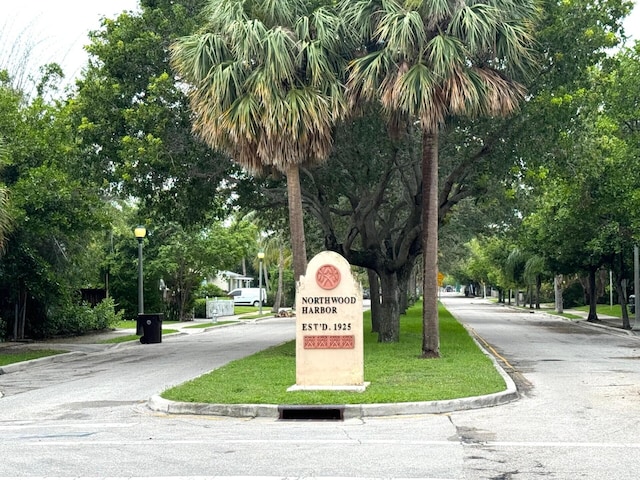 view of property's community with a lawn