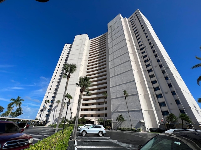 5200 N Flagler Dr Unit 803, West Palm Beach, FL 33407 - view of building exterior with uncovered parking