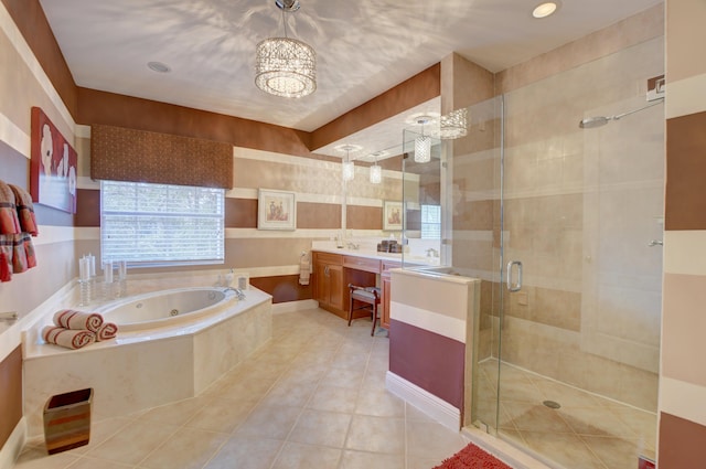 bathroom with tile flooring, plus walk in shower, oversized vanity, and an inviting chandelier