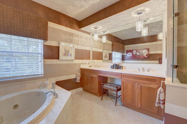 bathroom featuring tile floors, tiled tub, double sink, and oversized vanity