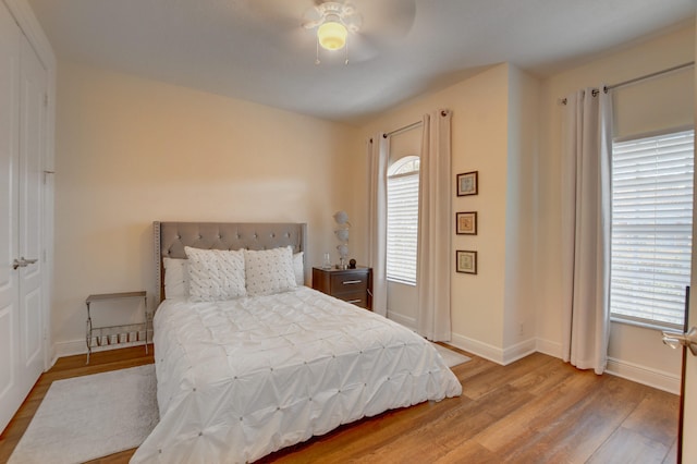 bedroom with ceiling fan and light wood-type flooring