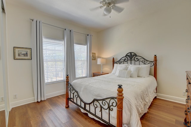 bedroom with ceiling fan and light wood-type flooring