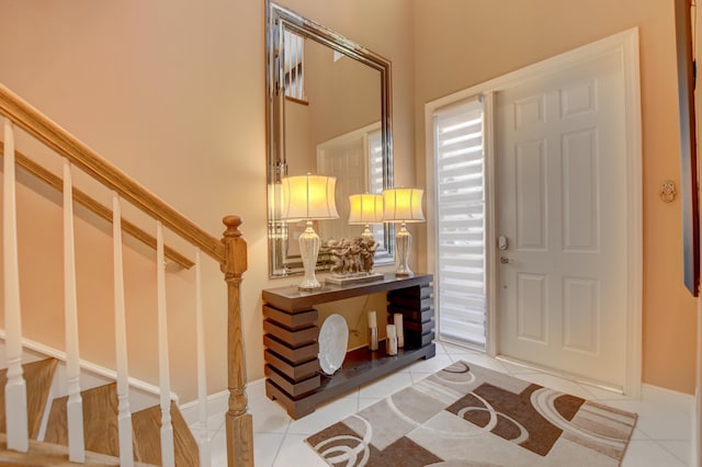 foyer entrance featuring light tile floors